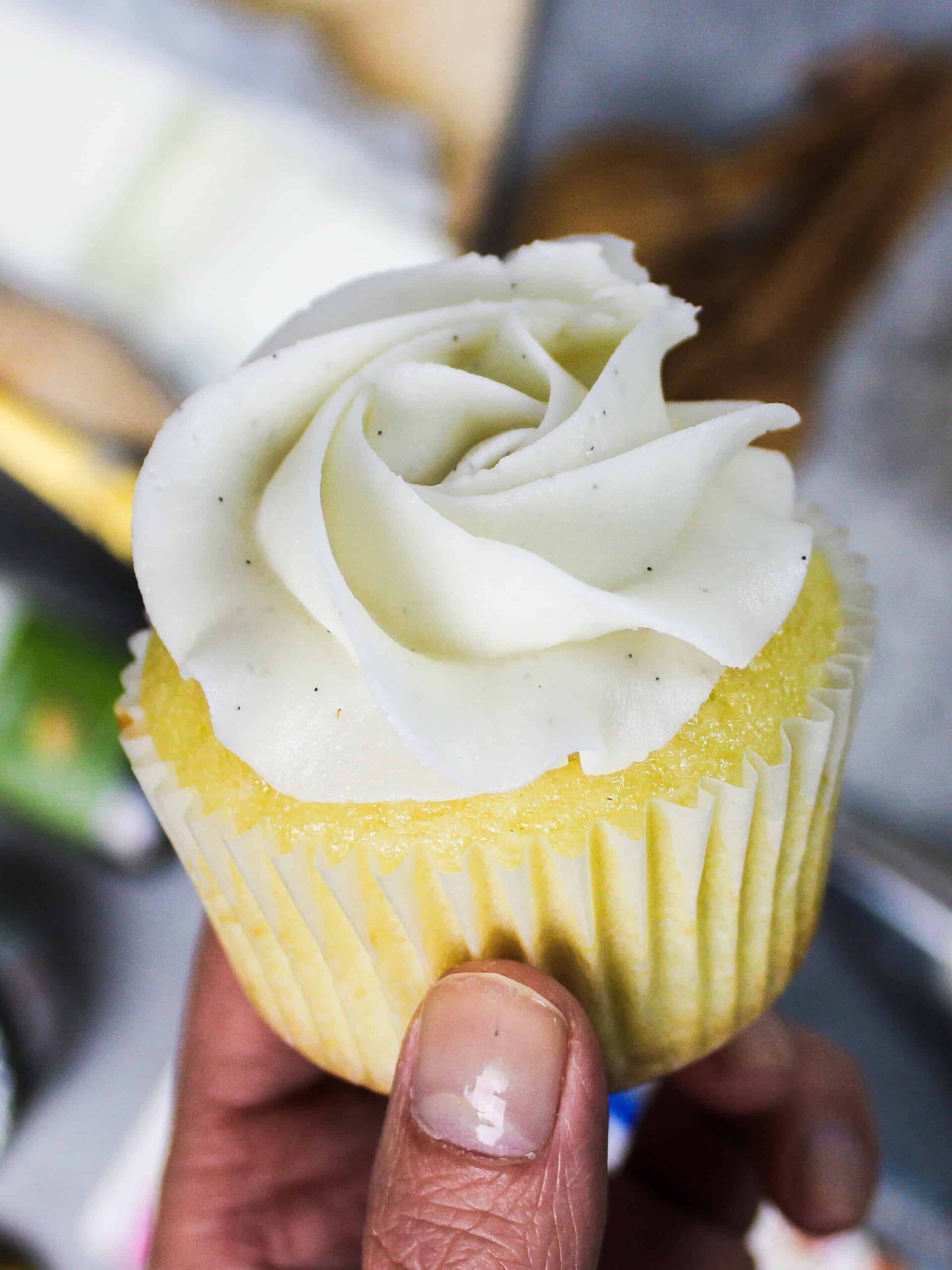 image of vegan buttercream frosting piped onto a cupcake