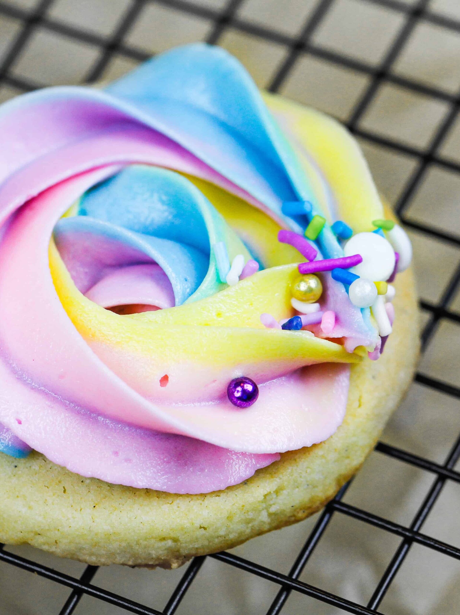 image of a buttercream cookie decorated with pretty pastel buttercream frosting
